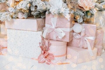 Christmas gift boxes under a beautifully decorated tree for New Year celebration