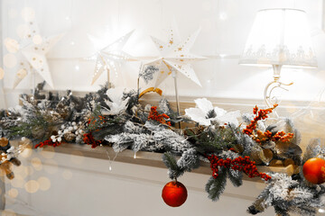 Beautifully decorated winter mantel with Christmas elements for the holidays