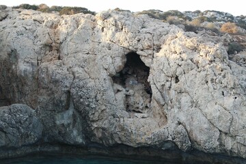 Coastal landscape with cliffs against the blue sea in Aiya Napa, Cyprus