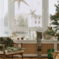 Festive seating nook with a cozy chair, adorned with holiday decor, candles, and a touch of greenery. Perfect for a warm, inviting Christmas setting.