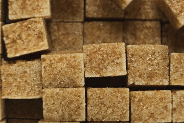 Cubes of brown cane unrefined demerara sugar.