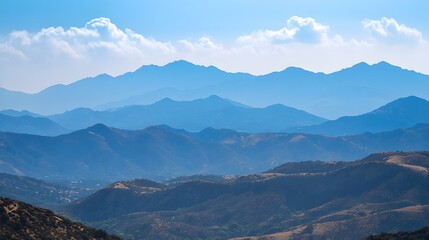 Obraz premium Serene Mountain Landscape with Soft Blue Hues