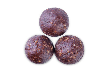 Nuts dates cocoa powder vegetarian balls on a white isolated background