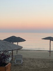 Beach in the evening. Ombrellas