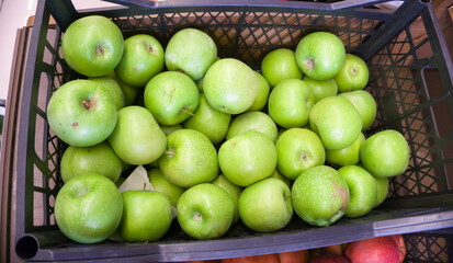 Fresh Green Apples in a Market Crate