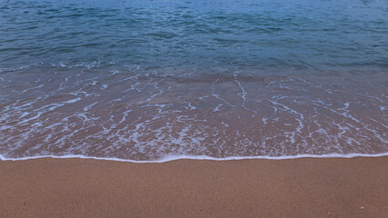 Soft turquoise wave on the coast, Mediterranean sea, Sardinia, Italy
