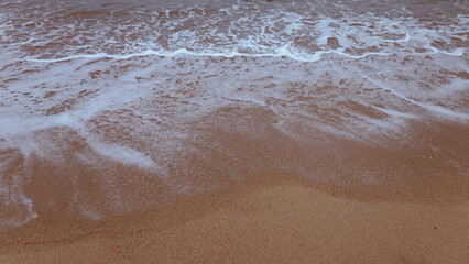 Soft turquoise wave on the coast, Mediterranean sea, Sardinia, Italy