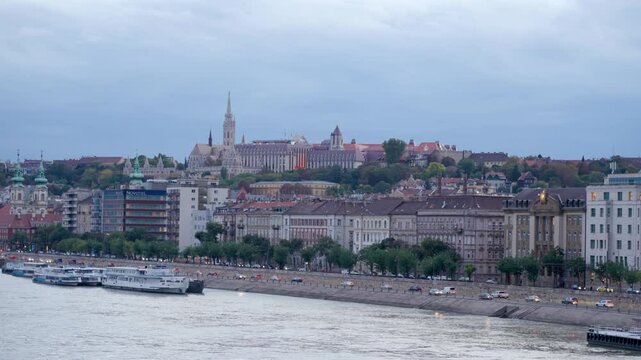 Budapest, Hungary - October 10, 2024: Stunning Fisherman's Bastion with Matthias Church Gothic Architecture. Evening view from the Margit Bridge on Danube river. Cityscape of Budapest.