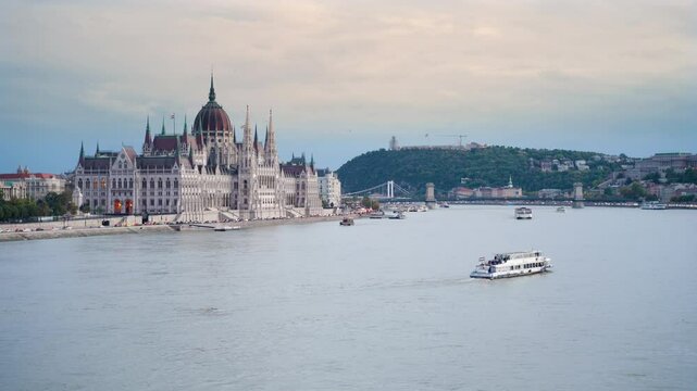 Cityscape of Budapest. Hungarian Parliament, Chain Bridge, Gell�rt Hill, Royal Palace, Fisherman's Bastion. All Budapest landmarks from the Margit Bridge on Danube river at sunset on cloudy day.