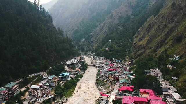 Aerial view of manikaran town with the parvati river and local houses in the parvati valley at himachal pradesh state of India.
