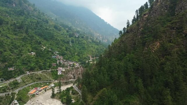 Aerial view of manikaran town with the parvati river and local houses in the parvati valley at himachal pradesh state of India.
