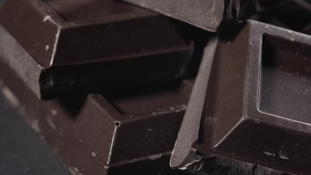 Pieces of dark chocolate on a plate. Bitter chocolate.