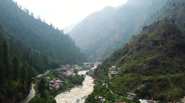 Aerial view of manikaran town with the parvati river and local houses in the parvati valley at himachal pradesh state of India.
