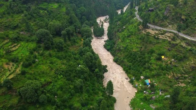 Aerial view of manikaran town with the parvati river and local houses in the parvati valley at himachal pradesh state of India.