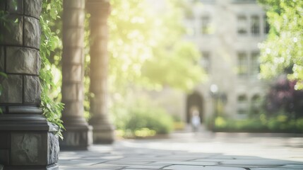 Blurred university campus with stone colonnades surrounded by lush greenery creating a serene bokeh effect in a peaceful outdoor setting