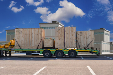 Platform for transporting goods. Wooden containers are prepared for transportation. Giant boxes are attached to platform on wheels. Vehicle for delivering large boxes. Container transportation