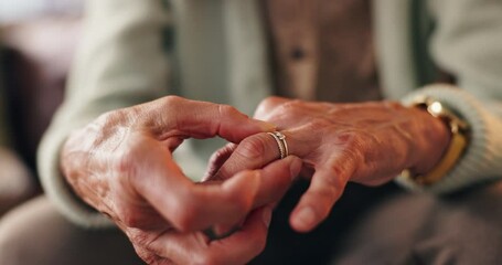 Memory, ring and hands of senior woman widow in grief counseling for loss, nostalgia and mental health. Remember, marriage jewelry and elderly person in therapy for dementia, alzheimer or reminder