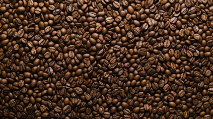 Rich texture of freshly roasted coffee beans on a wooden background for morning coffee ambiance and aromatic flavor inspiration.