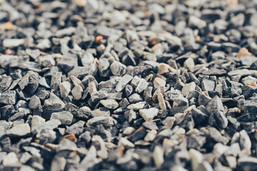 Gravel texture background with small stones in various shades of gray. This captures natural beauty of gravel, perfect for landscaping or construction projects