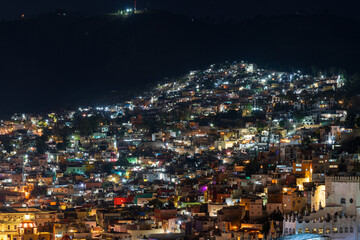 Colorful dense houses in Guanajuato, Mexico at night