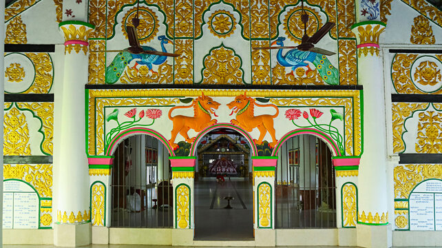 Intricate carvings adorning the entrance of the Mandapa at Uttara Kamalabari Satra, Majuli, Assam, India.
