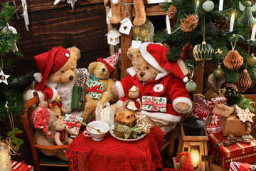 Teddy bear family sitting at Christmas table in rustic style interior