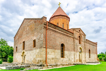 Fototapeta premium Ancient Caucasian Albanian Bulun Temple of Blessed Virgin Mary in Azerbaijan, Qabala region, August 2024