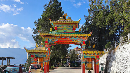 Grand entrance gate of Tawang Monastery showcasing intricate Buddhist architectural designs,...