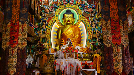 Statue of Lord Buddha in a meditative pose inside the main hall of Tawang Monastery, Tawang, Arunachal Pradesh, India.