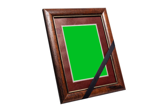 Brown Wooden Frame with Black Mourning Ribbon and Green Background Isolated on White