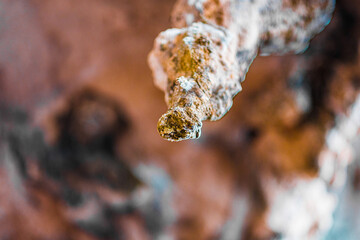 Close-Up View of a Stalactite in a Cave Showcasing Natural Geological Formations and Textures
