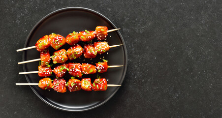 Teriyaki chicken skewers on plate