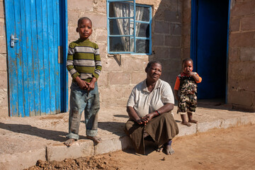 NGO charity project volunteers aim with aid to eradicate poverty, african children and mother...