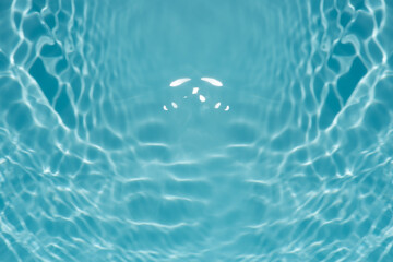Blue water with ripples on the surface. Defocus blurred transparent blue colored clear calm water...