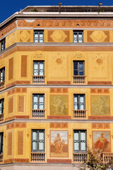 Obraz premium Facade of an apartment building with colorful frescoes in El Eixample, Barcelona, Spain, Europe
