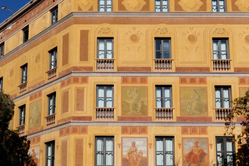 Obraz premium Facade of an apartment building with colorful frescoes in El Eixample, Barcelona, Spain, Europe