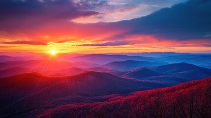 Fototapeta premium A breathtaking view of a dramatic sunset over a mountain range, with vivid colors and awe-inspiring scenery that captures the viewerâ€™s sense of wonder