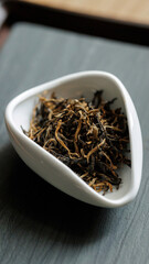 Delicate, aromatic Black Tea Leaves presented beautifully in a Modern Ceramic Bowl