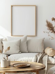 A white couch with throw pillows and a blanket in a living room with a wooden coffee table and a framed picture on the wall