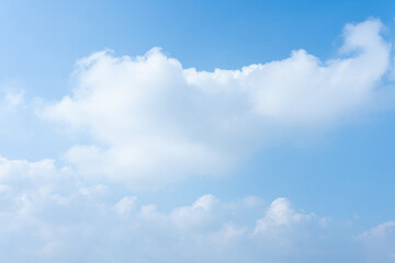 Serene Blue Sky with Fluffy White Clouds Nature Background