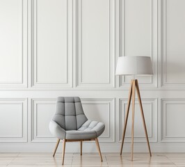 A gray armchair with wooden legs sits in front of a white wall with wainscoting. next to a wooden floor lamp with a white shade