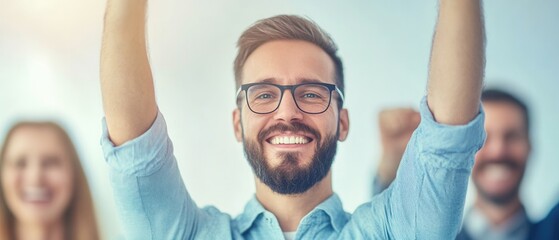Happy man celebrating success with raised arms and big smile.