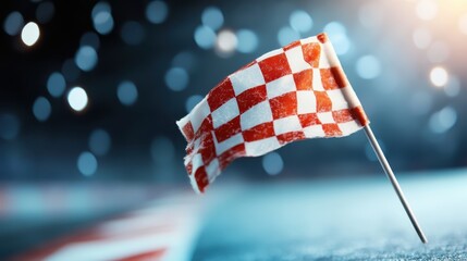 A red checkered flag captures the spotlight as it flutters against a backdrop of twinkling night lights, evoking feelings of excitement and anticipation.