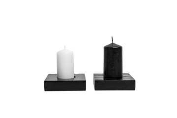 Black and White Candles on Minimalist Wooden Stand