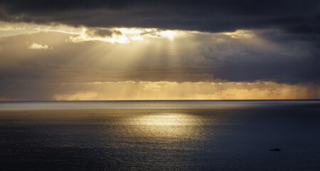 Sunbeams over the ocean on Anglesey North wales