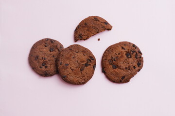 chocolate chip cookies on light pink background