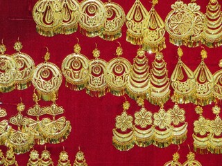 Obraz premium traditional gold Gold filigree earrings of indigenous women in Oaxaca, Mexico