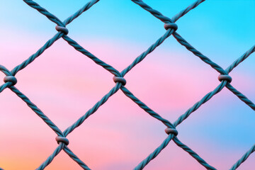 Fototapeta premium Interwoven Netting at Sunset, intricate patterns and textures highlighted by a warm, serene sunset glow creating a captivating atmosphere