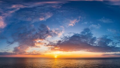 Fototapeta premium romantic colorful sunset panorama sky with rippled clouds