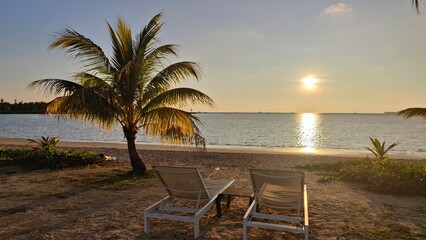 A beach restaurant with champagne during the sunset golden hour